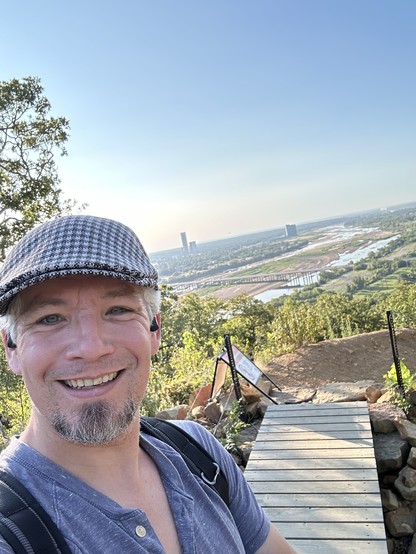 Selfie on top of a trail looking out over the Tulsa skyline.