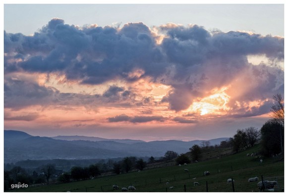 Dramatic early morning sky over distant hills