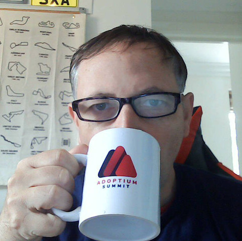 sxa sipping from an Adoptium Summit mug