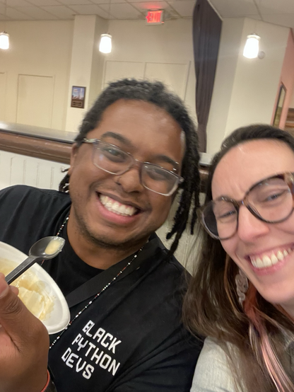 Jay and Loren smiling in a selfie with an empty bowl of ice cream