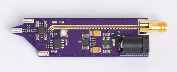 Photo of purple circuit board with coax connector for oscilloscope.