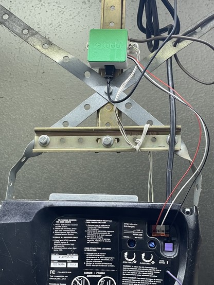 My newly installed ratgdo connected to my garage door opener.