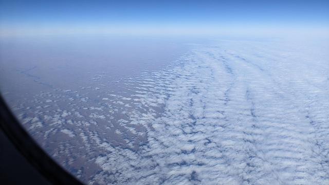 snow covered plains, ripples of tan and white