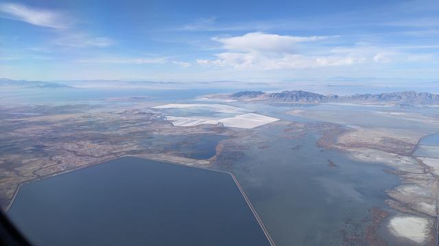 the salt lake of utah, with mountains and clouds in background