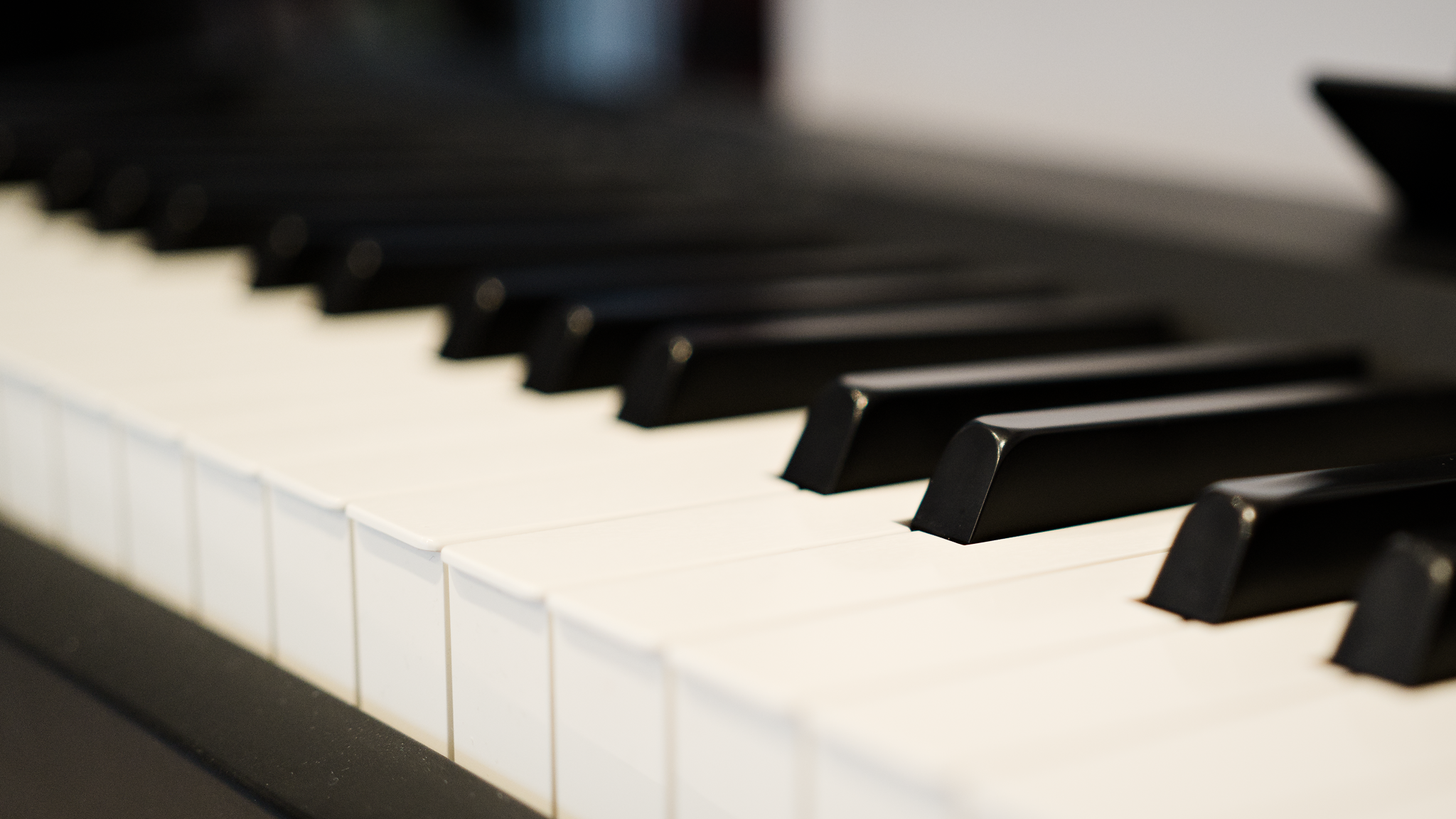 Diagonal view along a piano keyboard, with D-sharp in focus, and looking down.