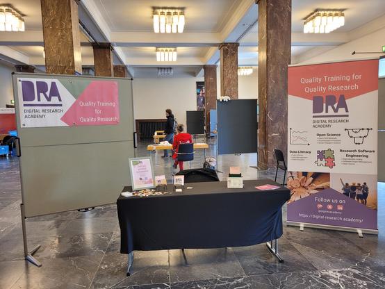 the booth with flyers and a DRA banner