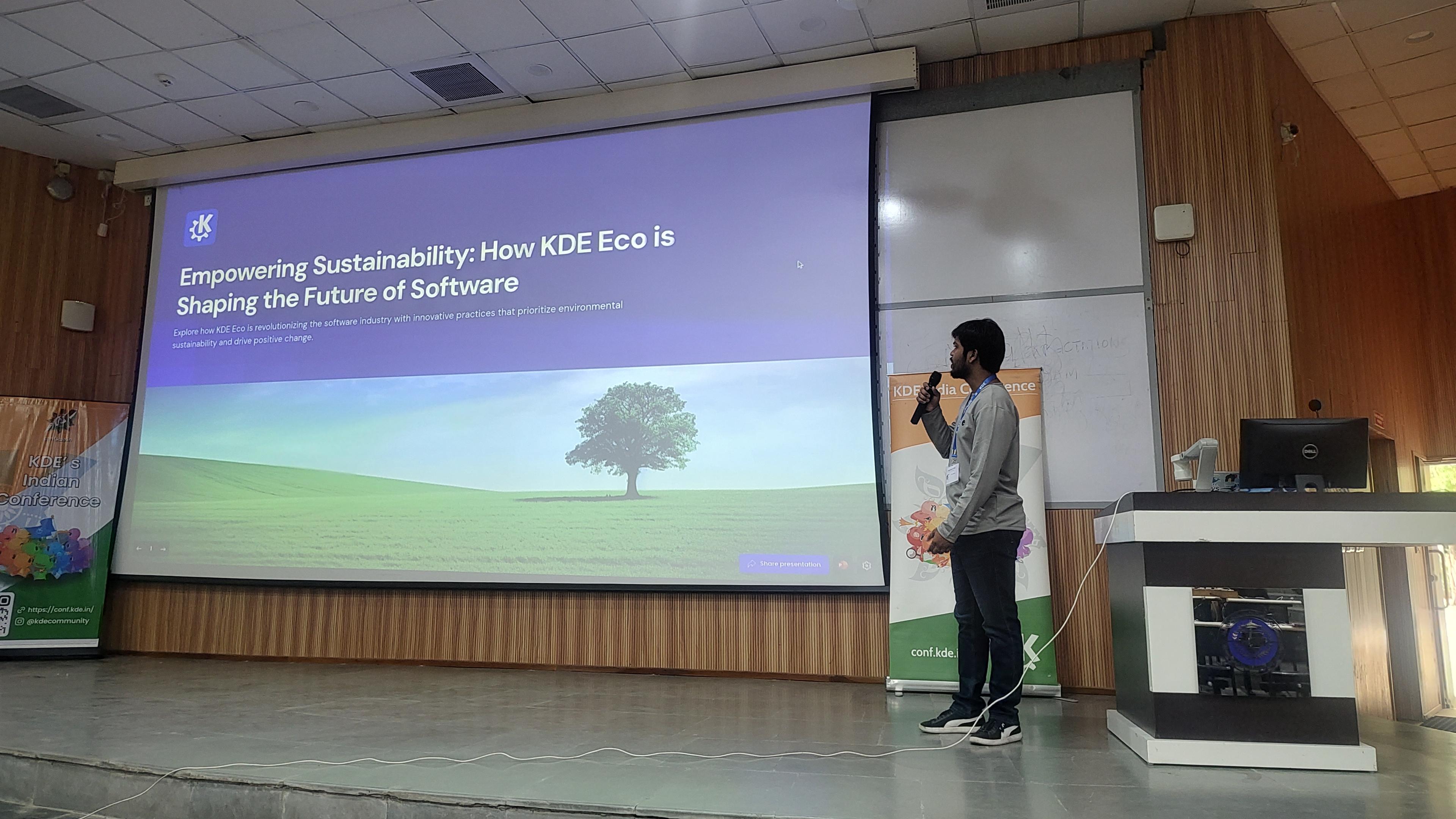 Speakers giving presentation about KDE Eco.