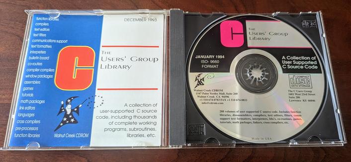 A to down view of the C Usercs Group Library CDROM. It is in the jewel case with the front cover of the included booklet flipped over in the left side. Walnut Creek dated December 1993.
