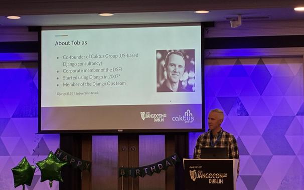 Tobias on stage behind the lectern at DjangoCon.eu Dublin