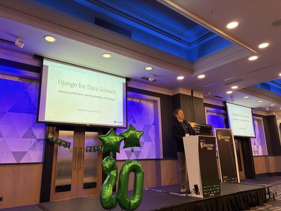 Will on stage presenting Django for Data Science 