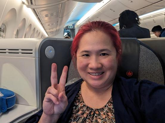 Selfie. Mariatta seated inside airplane.
Air Canada business class