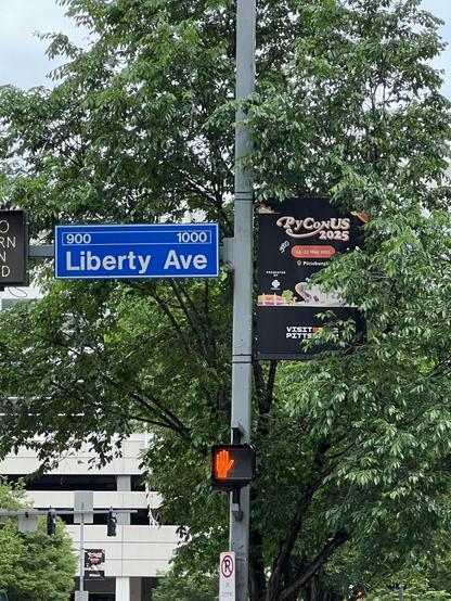 PyCon US sign outside the convention center next to Liberty Ave street sign