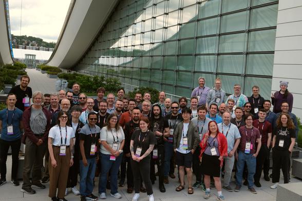 A large group of Python core developers and contributors at Python Language Summit 2025, outdoor at David L. Lawrence convention center