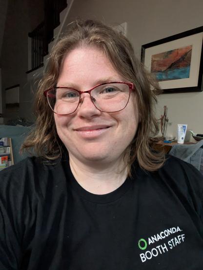 A selfie of the post author with a slightly swollen lip and wearing a black Anaconda T-shirt.