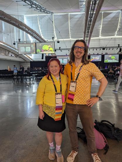 Mariatta wearing yellow Kebaya (a traditional top dress from Indonesia) and Cody wearing yellow Batik shirt (a traditional patterned shirt from Indonesia)