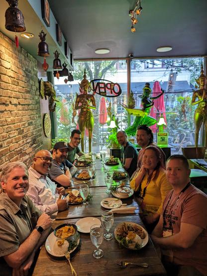 Photos of group of people dining together in a Thai restaurant.