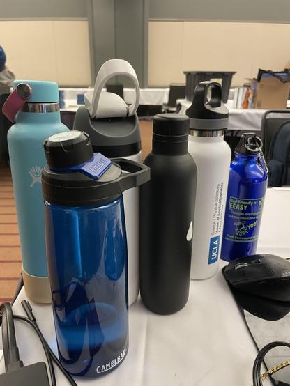 six reusable water bottles of various kinds