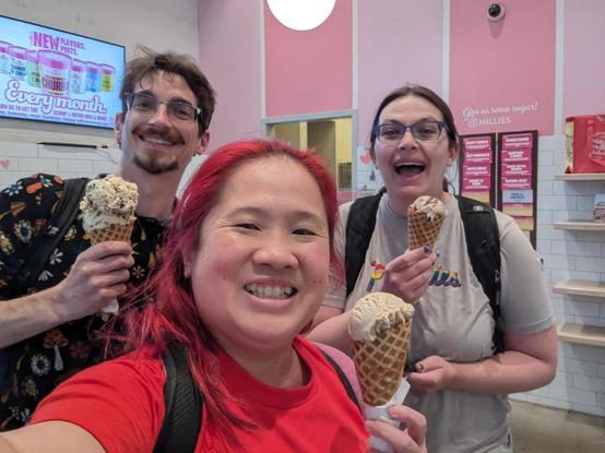 Ice cream selfie inside Millie's Homemade ice cream. Keith, Mariatta, and Sarah holding ice cream with waffle cones