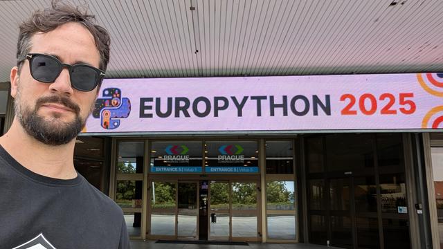 Person in front of the EuroPython 2025 venue entrance.