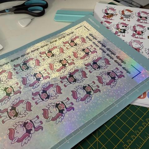 Close-up of a sparkly sticker sheet with Django pony stickers