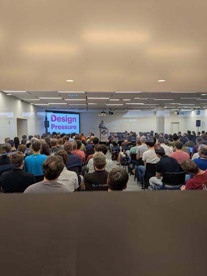 Picture showing the room where Hynek is giving a talk... From the outside. The room is full!