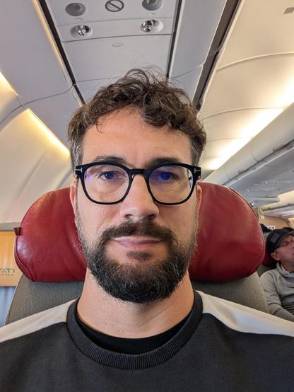 Selfie on me seated in the airplane