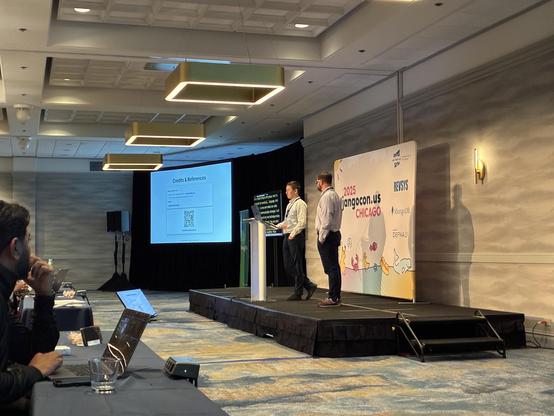 Muhammad on stage explaining cultural differences in a lightning talk