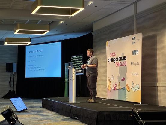 Richard on stage presenting nanodjango