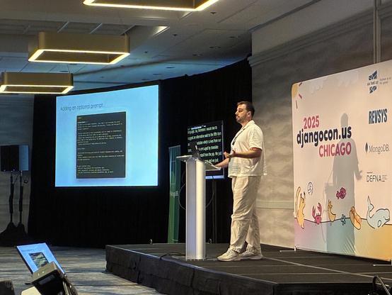 Efe on stage presenting yesglot capabilities and the workflow