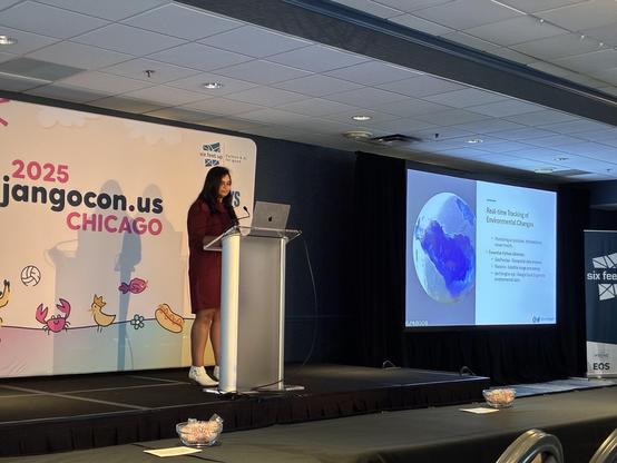 Drishti on stage next to her slides