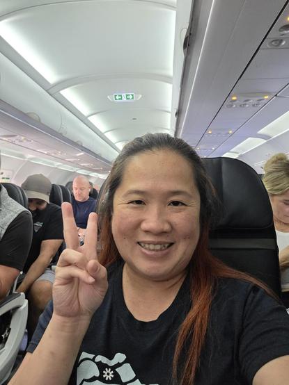 Mariatta selfie seated in an airplane