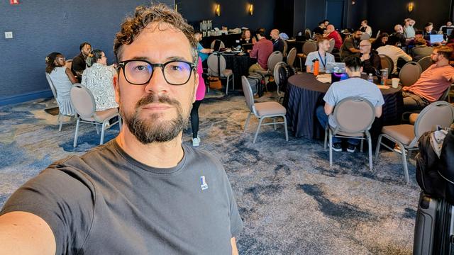 A selfie with people sitting in the background