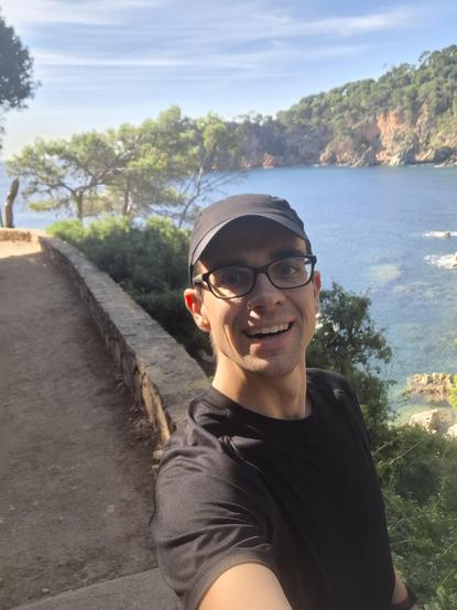 Mariusz with the lovely blue water and clifs.