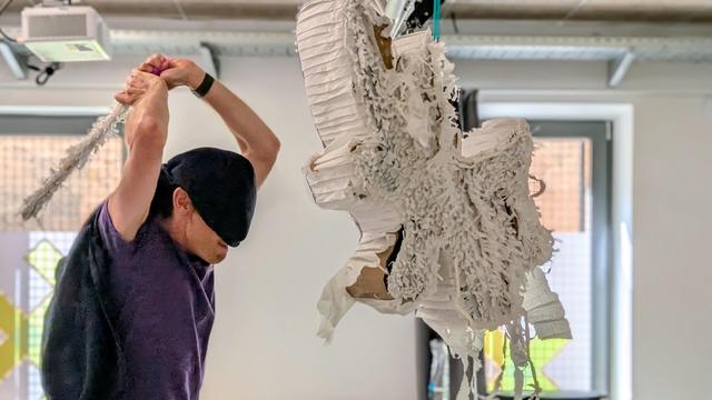 Person crashing a pinata 