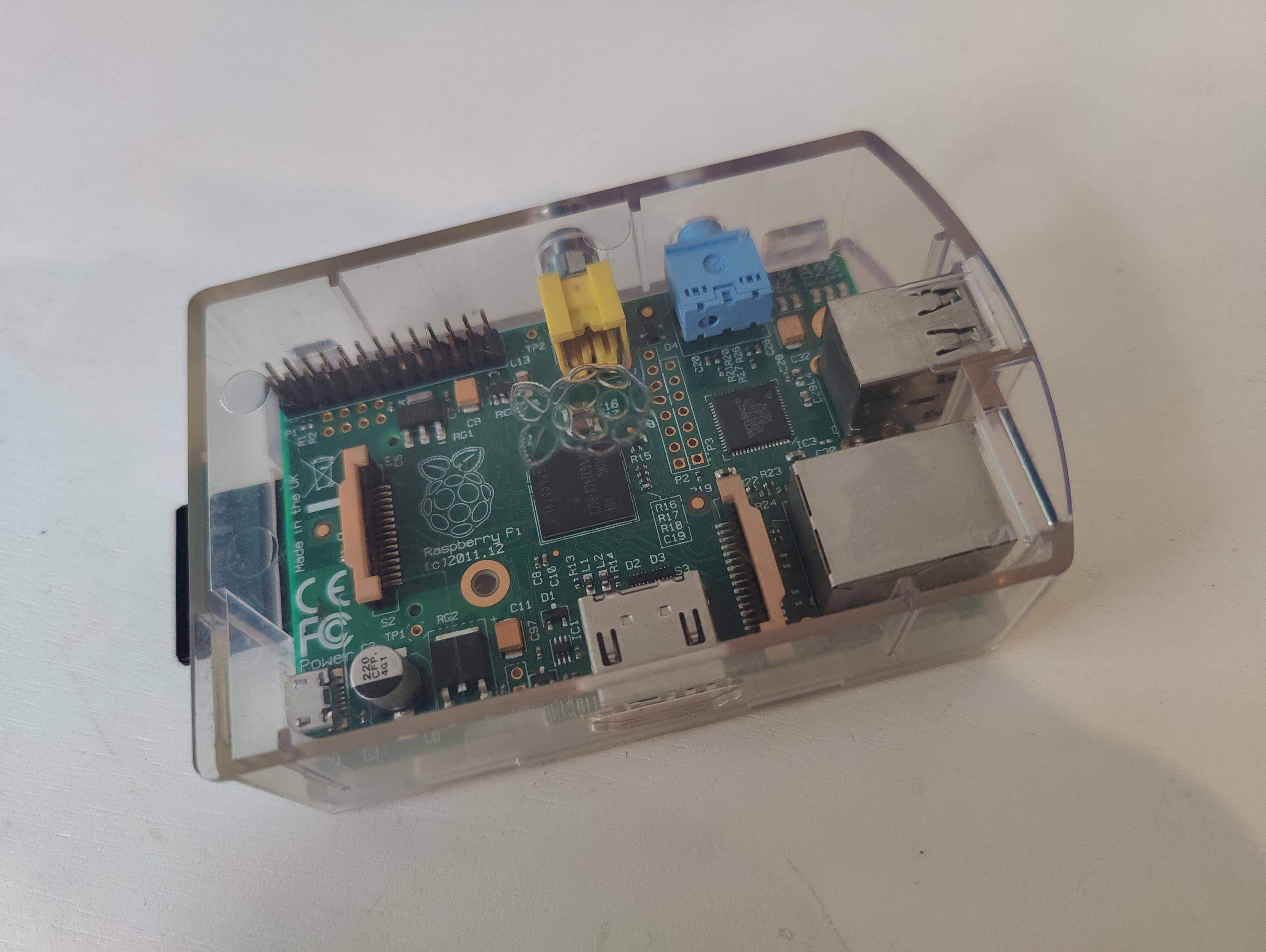 a picture of an old Raspberry-Pi 1 inside a transparent case