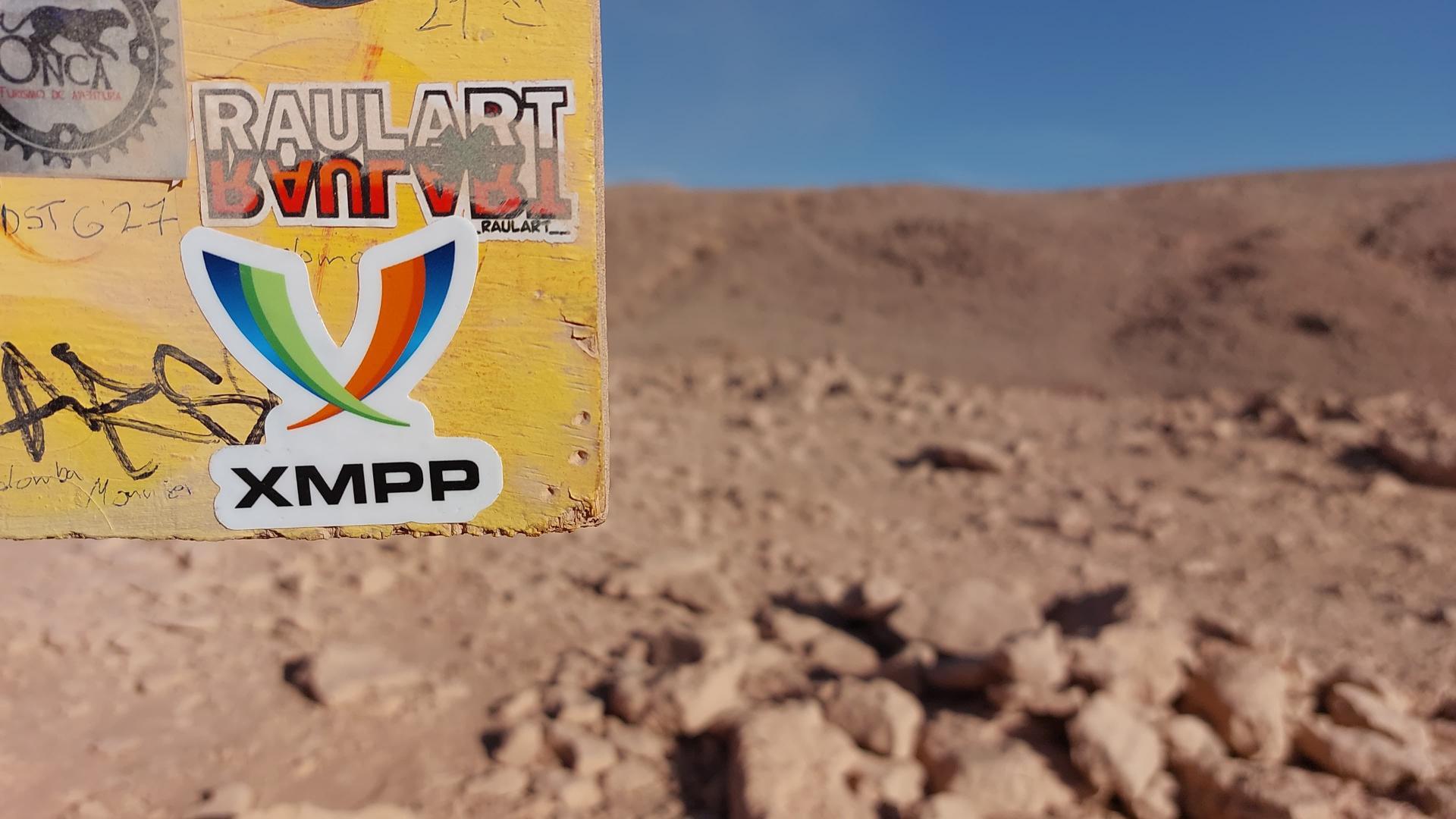 The XMPP Logo sticker on a sign in somewhere in the Atacama desert in Chile