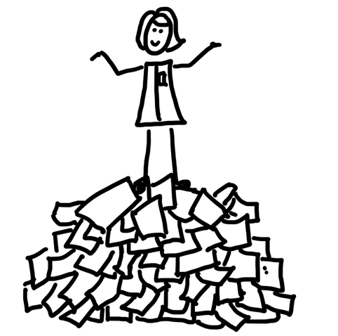 Researcher standing on a pile of papers