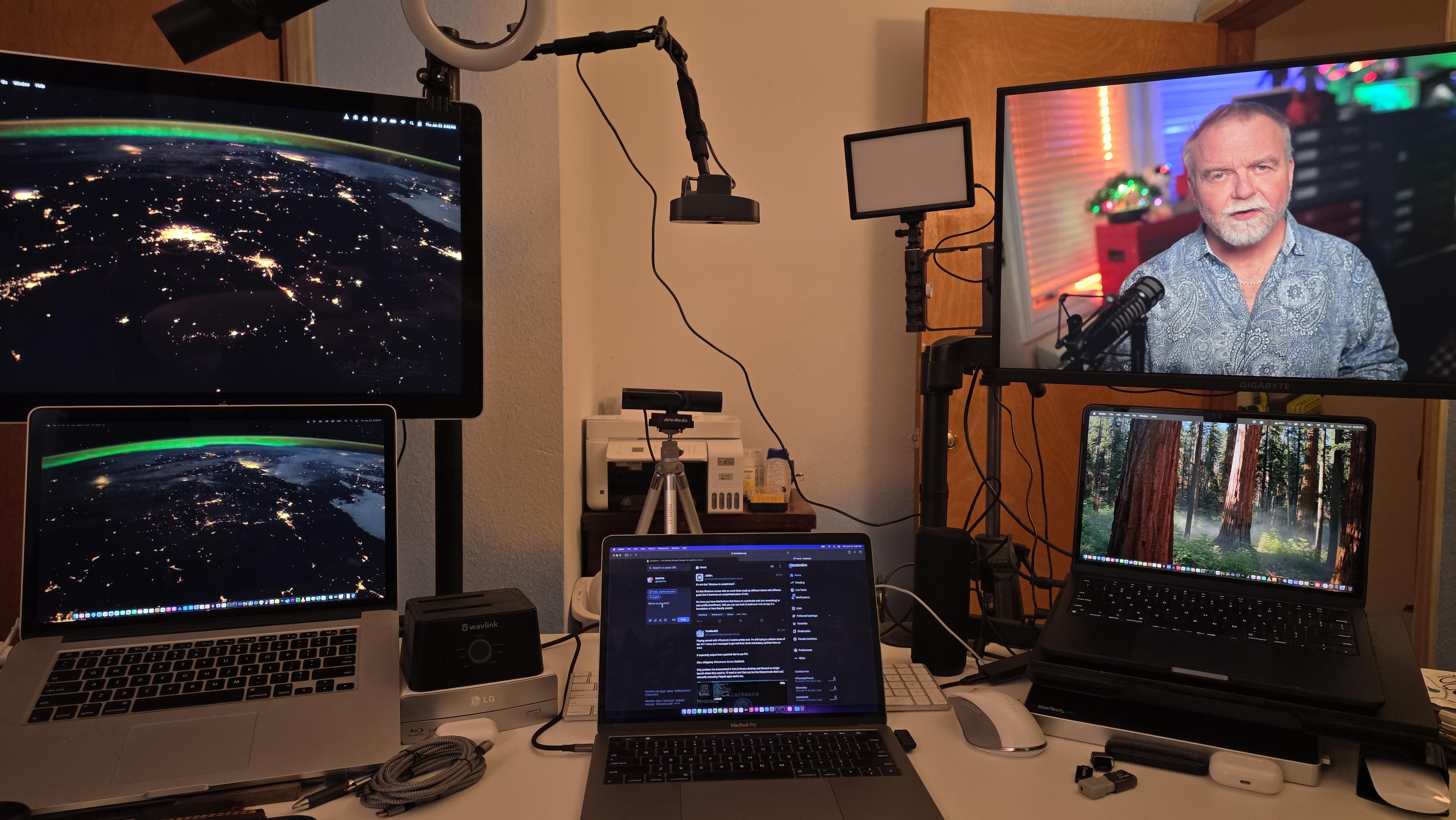 Setup for recording YouTube videos. Have nice white desk, front facing camera, down facing camera for working on products and unboxing. Two side setups for scripts or general notes. Two new lights for better lighting control.