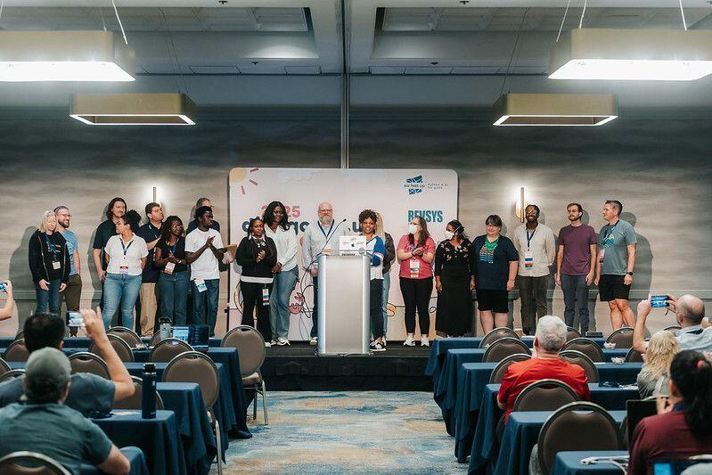 The organizing team on stage at DjangoCon US 2025