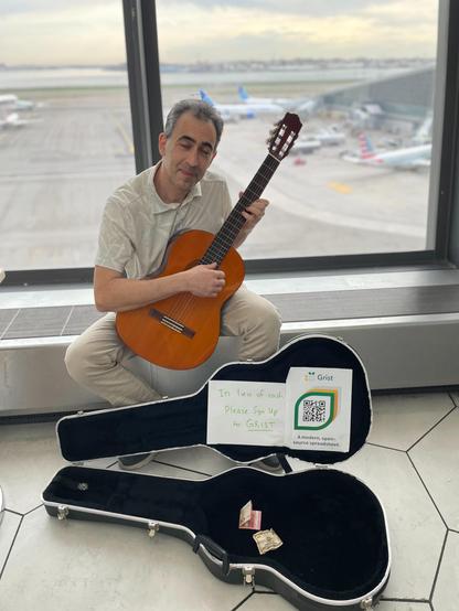 Dmitry busking at an airport