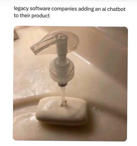 A liquid soap pump dispenser has been shoved into a bar of soap that is sitting on the edge of a sink. Caption says "legacy software companies adding an AI chat it to their product"