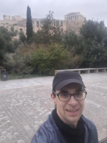 Mariusz face with the Acropolis ruins in the background