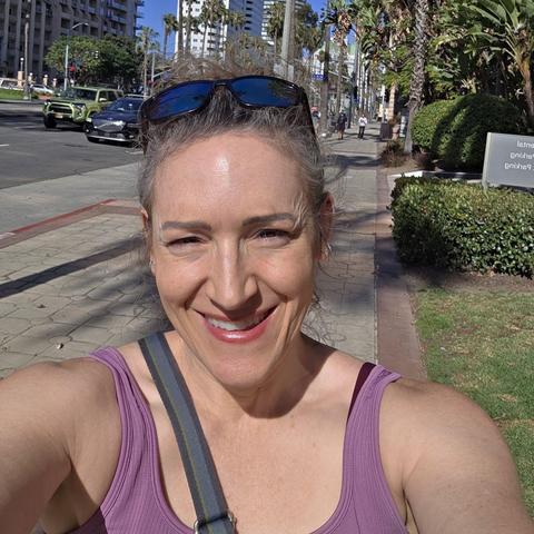 An image of a female on the streets of long beach smiling