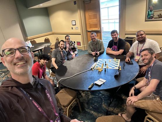 A bunch of smiling chess playing pythonistas