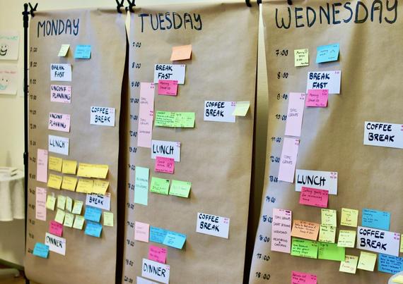 The retreat schedule on big posters with sticky notes