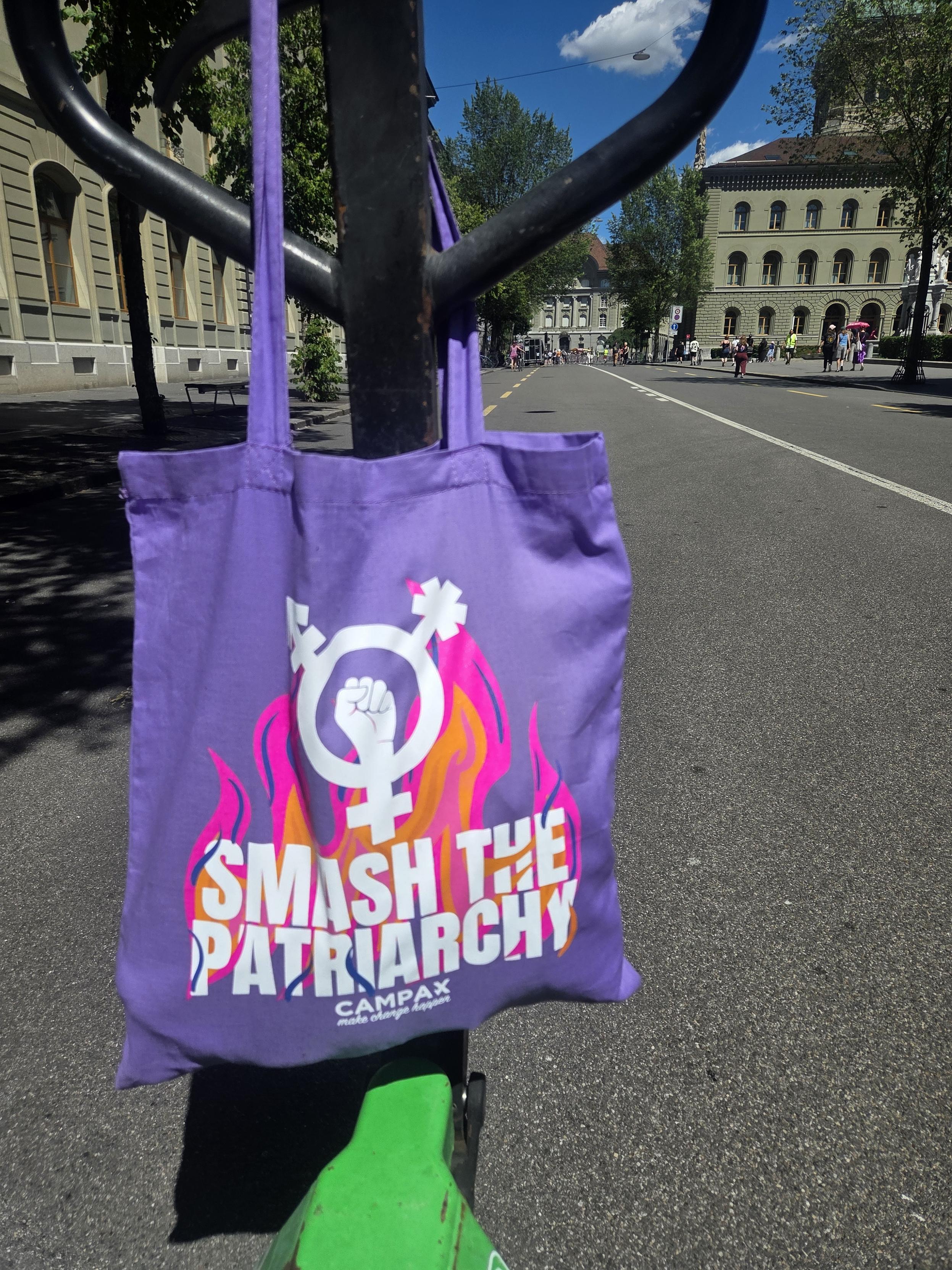A purple bag with "smash the patriarchy" on it 💜