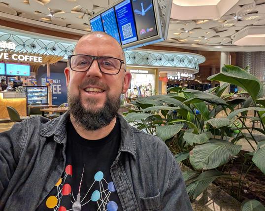 me, tired, in the Mumbai Airport at 2am
