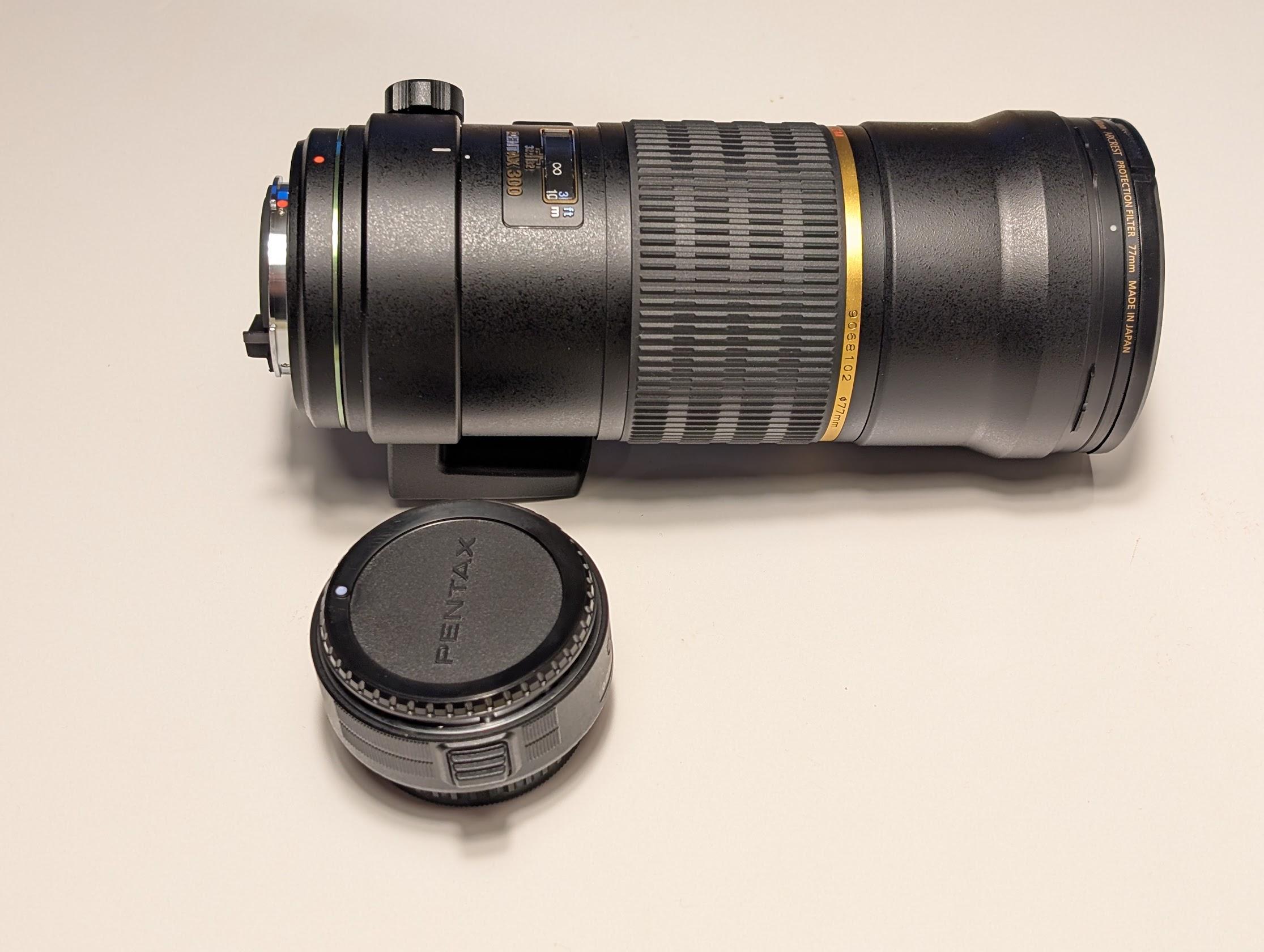 A 300mm lens and a 1.4x extender.