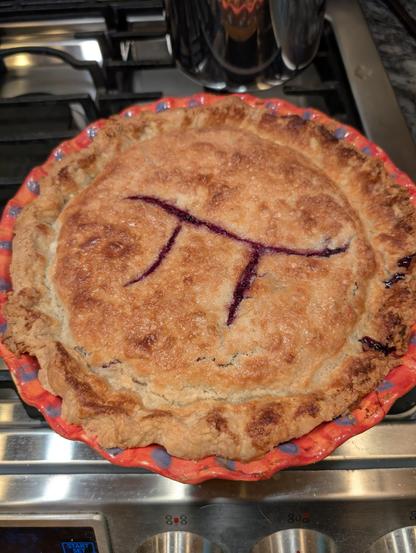 An instance of Oregon's state pie (marionberry) inscribed with π which appears in the color of the fruit.