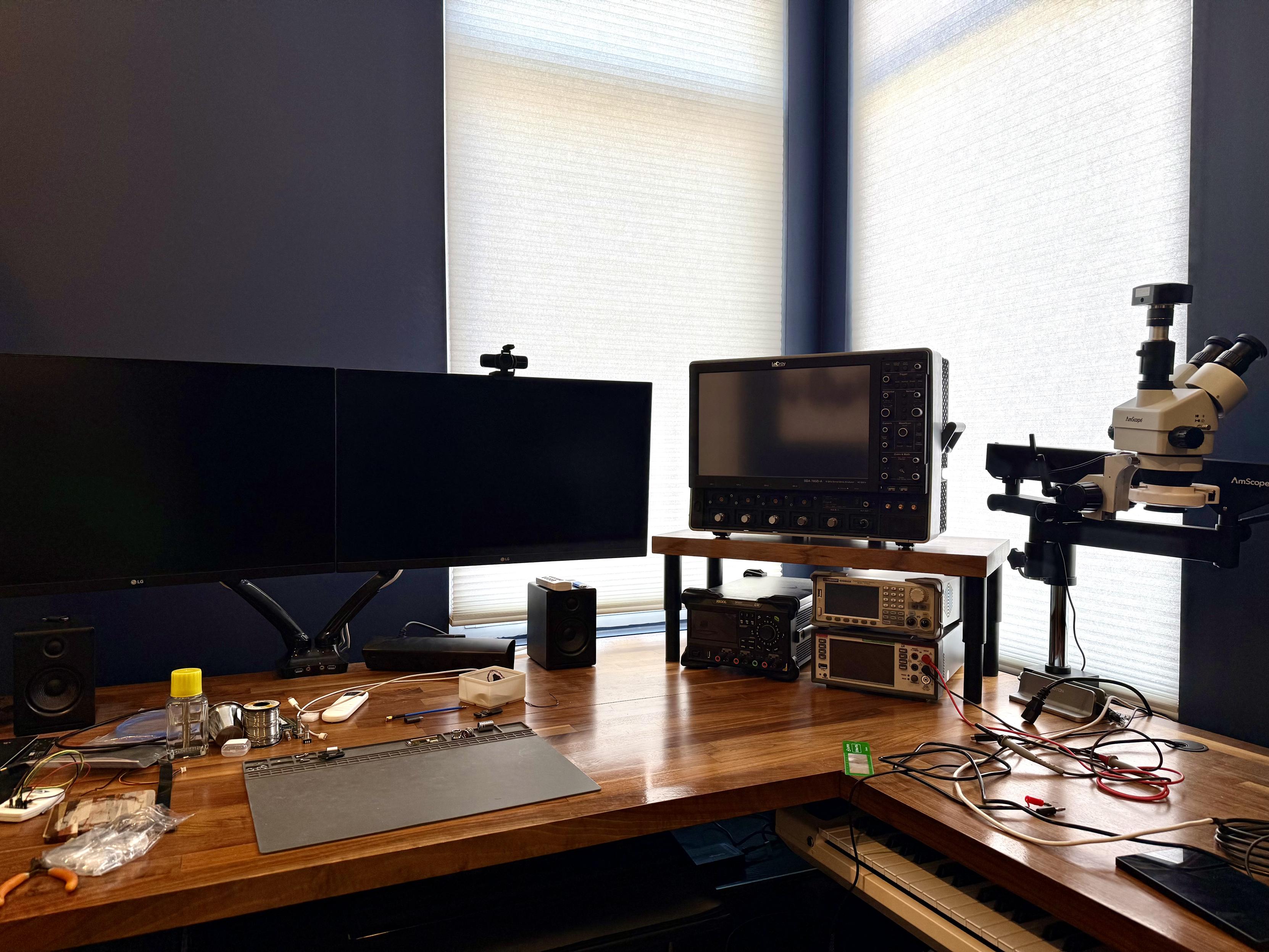 LeCroy SDA760Zi-A sitting on top of a riser with a walnut butcher block surface. Underneath are a Rigol DP2031, a SDG6022X, and a Keithley DMM6500